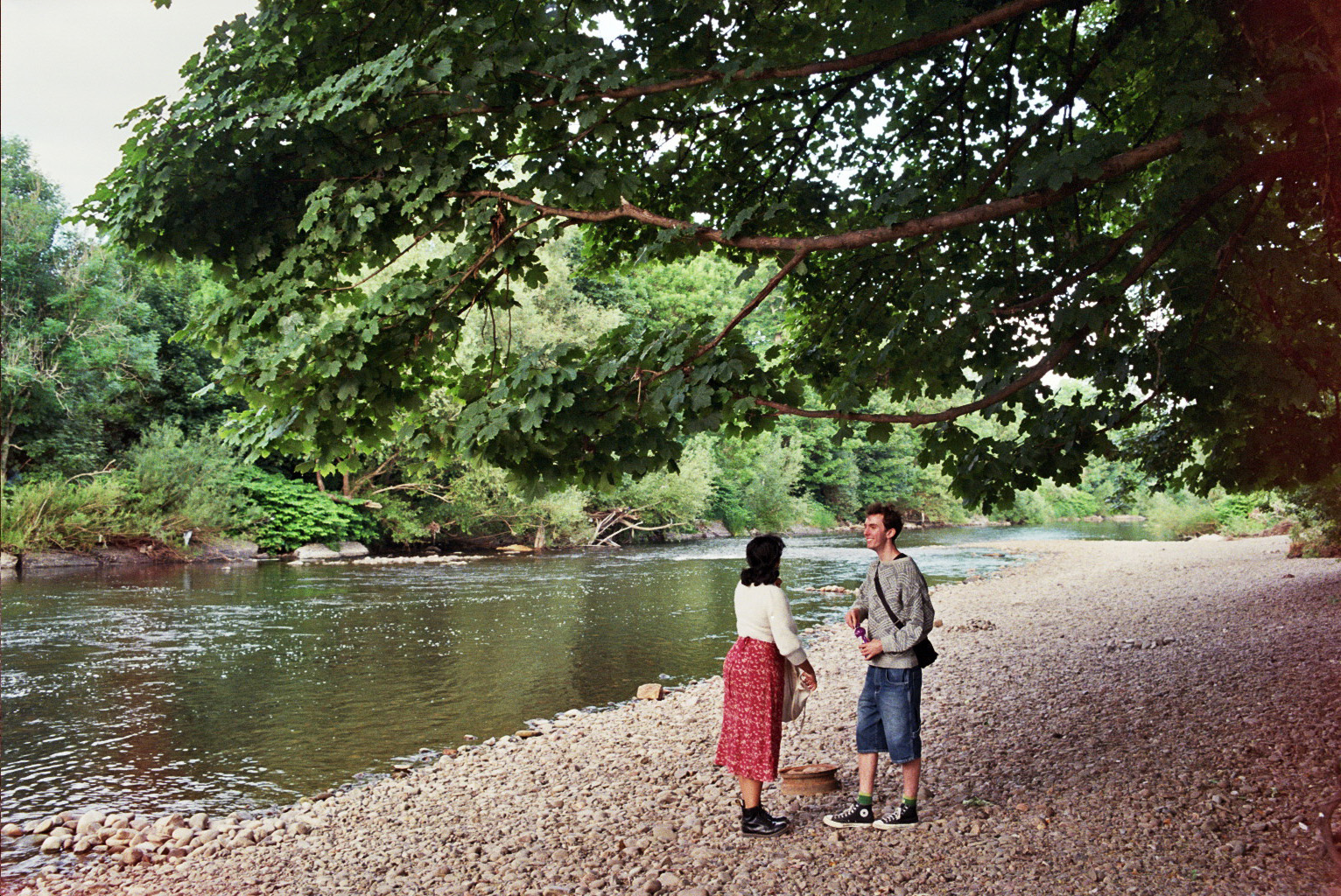 Two people by a river